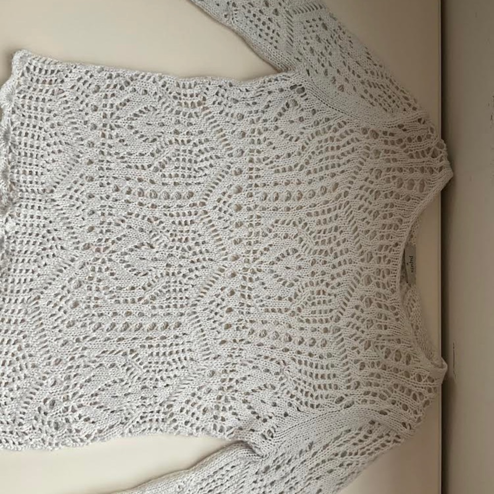 A white see-through long sleeve shirts.